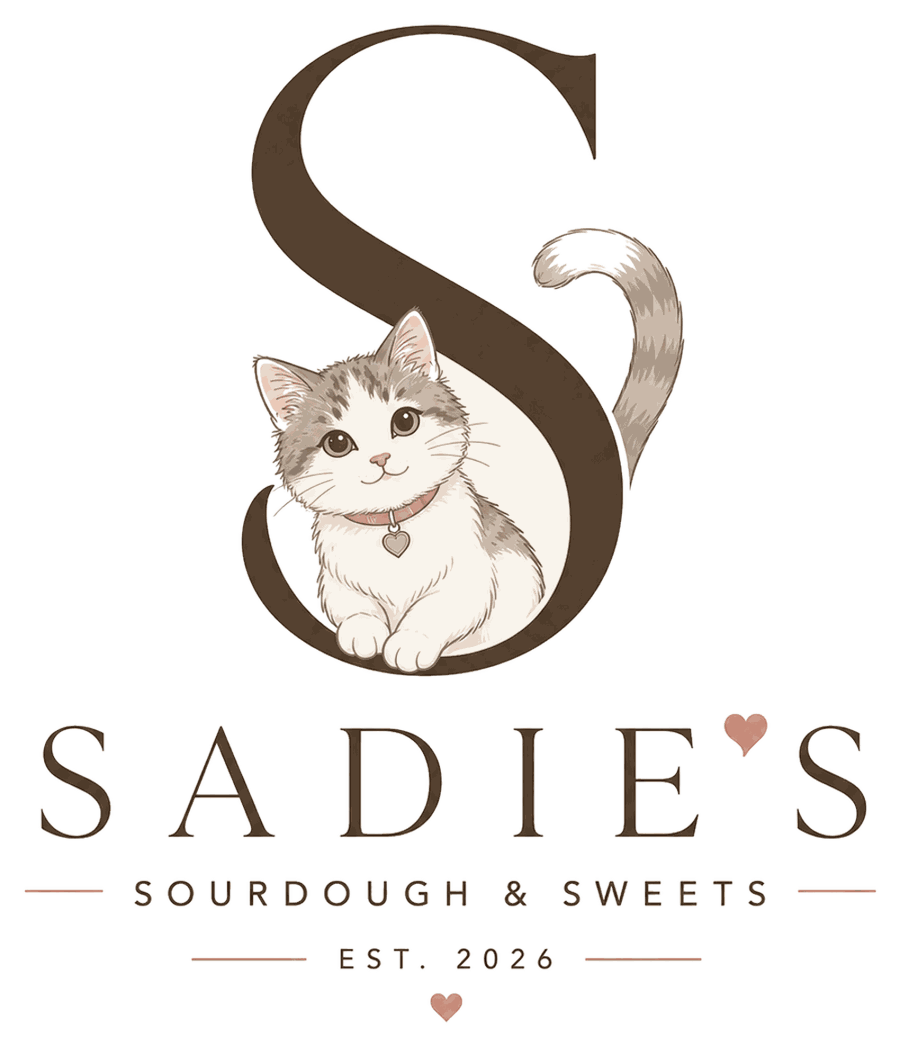 Sadie's monogram: a letter S with a gray and white kitten resting inside it